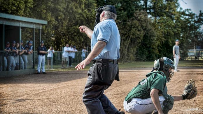 VGW-Third-Lawsuit-Victory Ref signalling strike three in a baseball game
