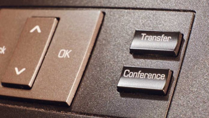 1-800-gambler-transfer-request Transfer and conference button on landline phone