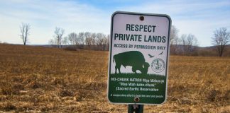 Wisconsin tribe latest group to take Kalshi and Robinhood to court Sign asking to respect Ho-Chunk Nation tribal land