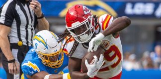 Kalshi self-certifies player props and points spreads ahead of football season Kansas City Chiefs running back Kareem Hunt runs past LA Chargers linebacker Daiyan Henley during an NFL game