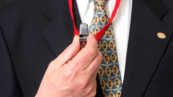 businessman holding a whistle