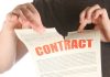 A person rips up a contract