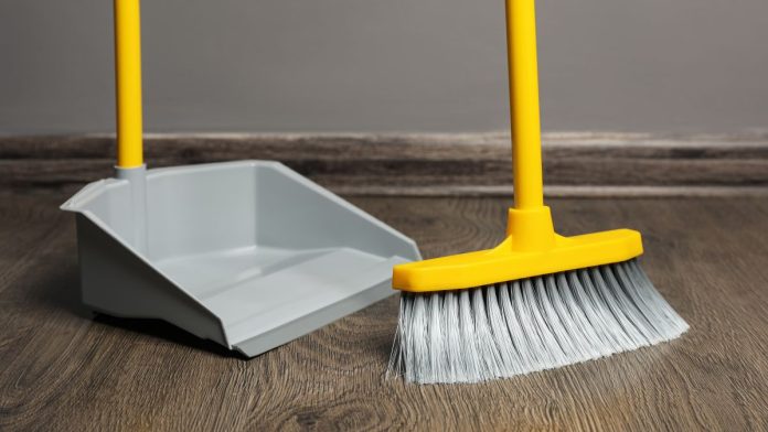 Publishers-Clearing-House-strongly-opposed-to-California-sweeps-ban A broom sweeping a floor into a dustpan