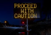 A warning sign stands as a South Dakota regulator warns the public about fake online casinos.