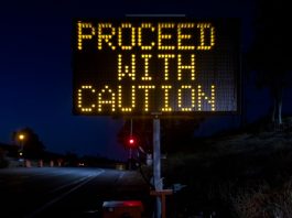 A warning sign stands as a South Dakota regulator warns the public about fake online casinos.
