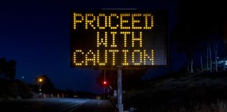 A warning sign stands as a South Dakota regulator warns the public about fake online casinos.
