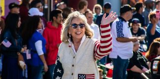 Titus tacks FAIR BET Act onto 2026 national defense bill Rep. Dina Titus waves while wearing clothing adorned with the U.S. flag