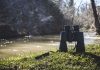 A pair of binoculars, representing Sightline, next to a river representing BetRivers