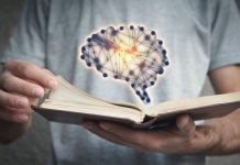 Better Collective rewrites Playbook with new AI sports betting tool A man flicking through a book