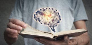 Better Collective rewrites Playbook with new AI sports betting tool A man flicking through a book