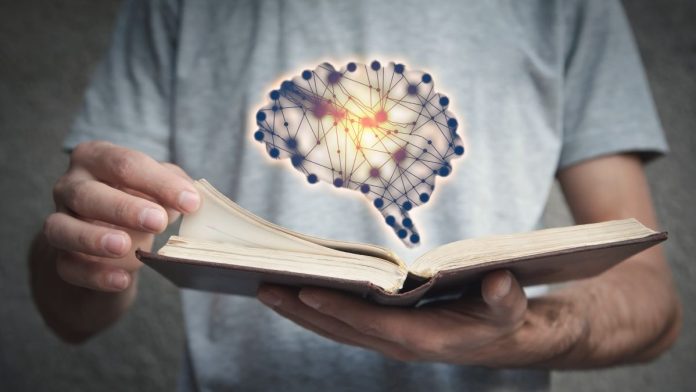 A man flicking through a book