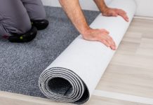 Caesars Sportsbook rolls out NFL live betting upgrades with Kero Sports A person rolling out new carpet onto a hard wood floor
