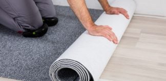 Caesars Sportsbook rolls out NFL live betting upgrades with Kero Sports A person rolling out new carpet onto a hard wood floor