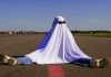 DraftKings looks to fuel further parlay growth with NFL Ghost Leg payout A person dressed as a ghost wearing sunglasses and sat with their legs spread