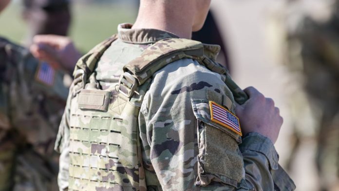 Government-not-combating-military-gambling-disorders,-says-auditor A man in US ARMY attire with the American flag on his sleeve
