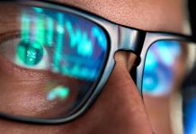 A person with glasses as Hard Rock Bet is set to use Genius Sports' BetVision product.