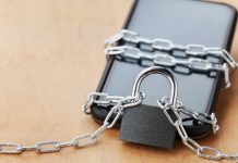 MA regulators take steps to require books to notify limited bettors Phone chained up