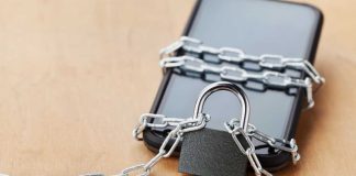 MA regulators take steps to require books to notify limited bettors Phone chained up
