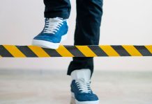 New York lawmaker proposes banning sportsbooks from limiting sharps A person stepping over a barrier intended to limit their movement