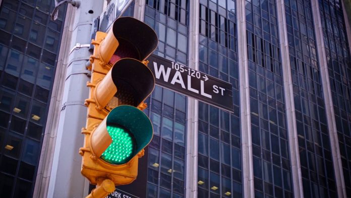 A green traffic light on Wall Street