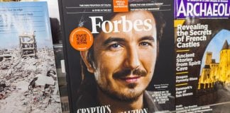 Robinhood sues MA gaming regulator and AG, says it has no choice A photo of Robinhood CEO Vlad Tenev on the front cover of Forbes magazine