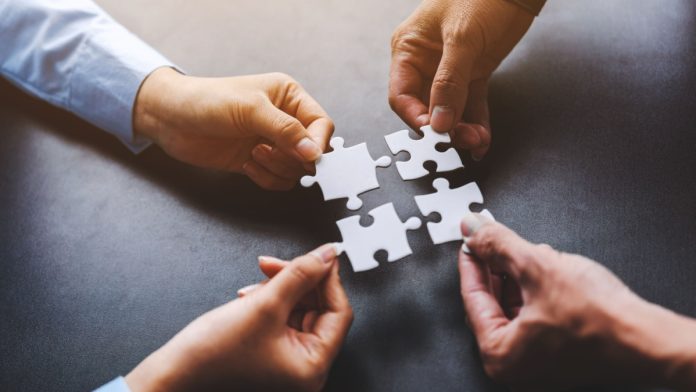 SPGA-SGLA-Consolidate-One-Trade-Group Puzzle pieces as two social gaming groups combine forces.