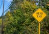 Titus’ attempt to add FAIR BET Act to defense bill goes nowhere A Dead End road sign in front of a background of trees