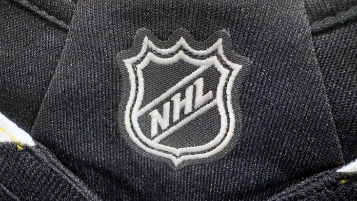 AGA-takes-dim-view-of-leagues-cozying-up-with-prediction-markets The NHL logo stitched onto a jersey
