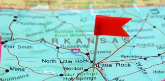 A red flag pinned to Little Rock on a map of Arkansas