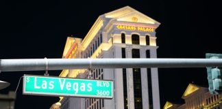 Caesars will not put state licenses at risk over prediction markets A shot of a Las Vegas Blvd street sign with Caesars Palace visible in the background