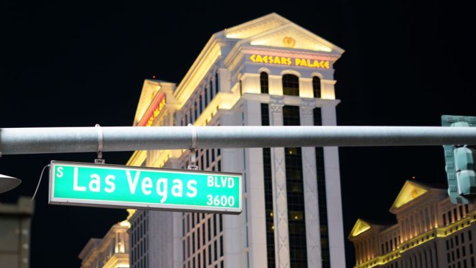 Casino-Leaders-Prediction-Markets-Issue-Bigger-Than-Betting A shot of a Las Vegas Blvd street sign with Caesars Palace visible in the background