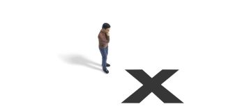 Figurine of a man next to a black X