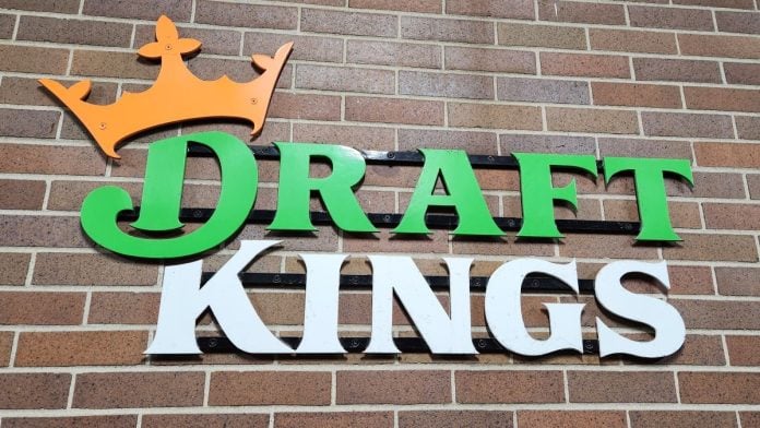 DraftKings-to-offer-users-access-to-Evive-responsible-gaming-tools The DraftKings logo against a brick wall