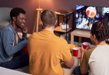 A group of friends watches sports like bettors would do.