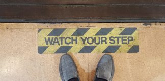 Michigan regulator warns operators to keep distance from event contracts A warning sign telling people to watch their step