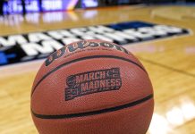 NCAA March Madness ball as the tournament will require teams to provide player injury reports.