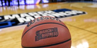 NCAA March Madness ball as the tournament will require teams to provide player injury reports.