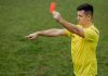 Soccer referee with penalty marker as Super Group faces a monetary penalty in New Jersey.
