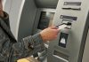 A person at an ATM as Pavilion Payments brings its services to three tribal casinos in Oklahoma.