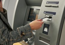 A person at an ATM as Pavilion Payments brings its services to three tribal casinos in Oklahoma.