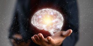 A concept image of a man holding a brain