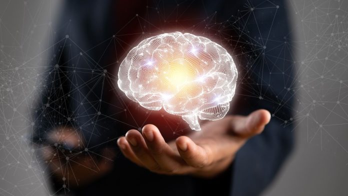 PrizePicks-picks-Mindway's-brain-for-AI-problem-gaming-detection A concept image of a man holding a brain