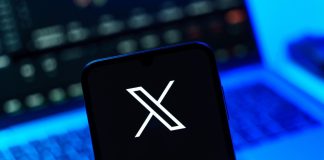 Better Collective teams up with X to launch AI-powered tool Playbook X on a person's phone after signing the social media platform secured a deal with Better Collective.