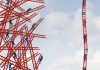 People climb a ladder next to others that are crashed