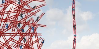 People climb a ladder next to others that are crashed