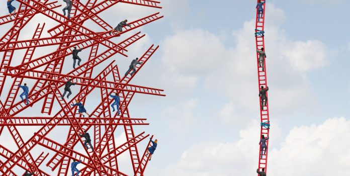 People climb a ladder next to others that are crashed