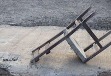 A discarded, upturned chair