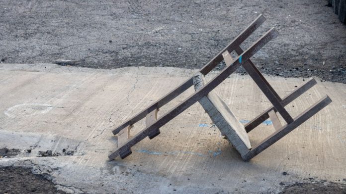 A discarded, upturned chair