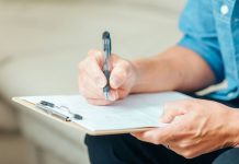 A person filling out a questionnaire