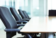AGA elects Delaware North CEO Lou Jacobs as new chair Chairs around a table in a corporate boardroom